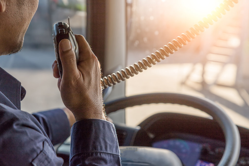 Truck Driver Making Talking Through Radio,Communication on the Highway,Concept transport on road,spot focus.