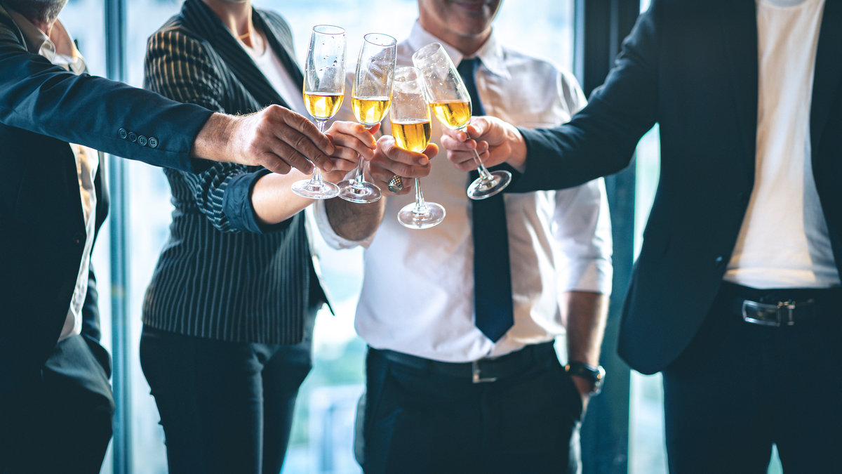 Group of business people toasting champagne glasses for the cele