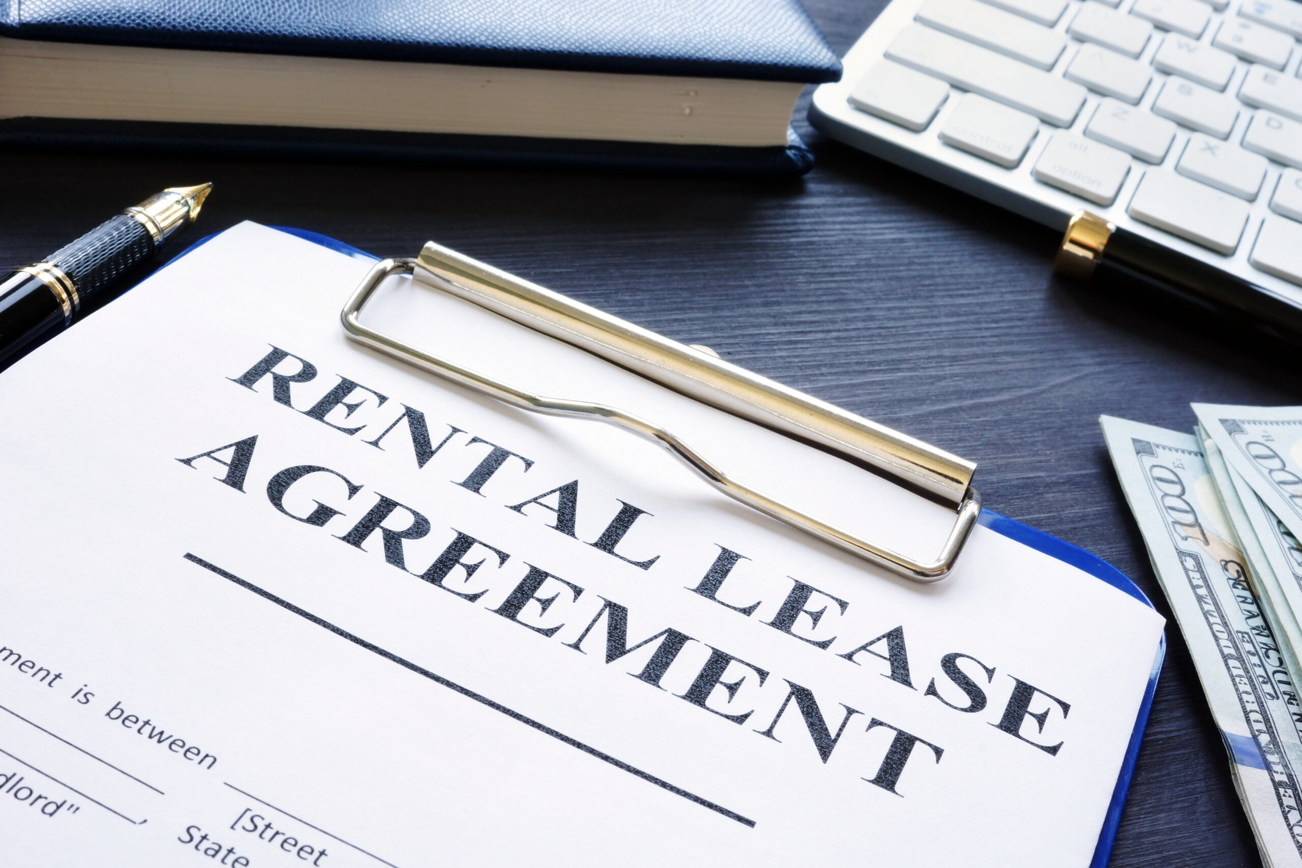 Rental lease agreement with pen on a desk